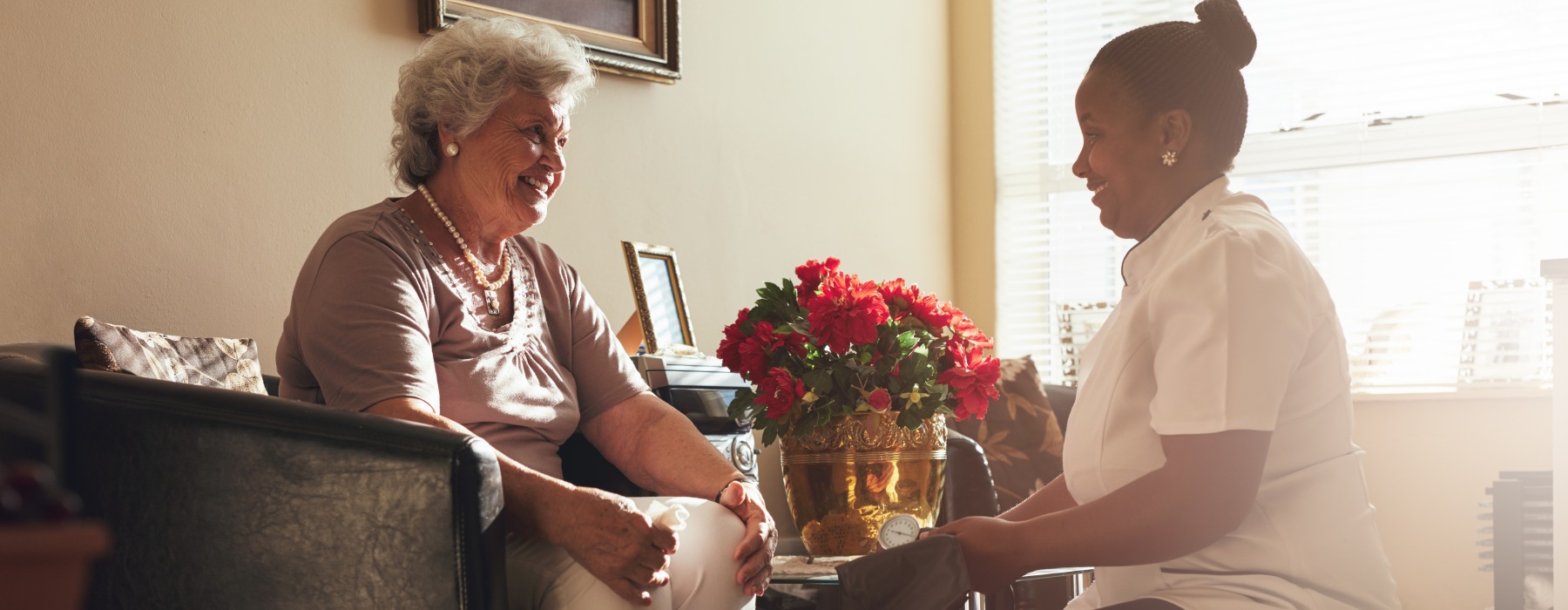 Nurse providing fall assistance to resident