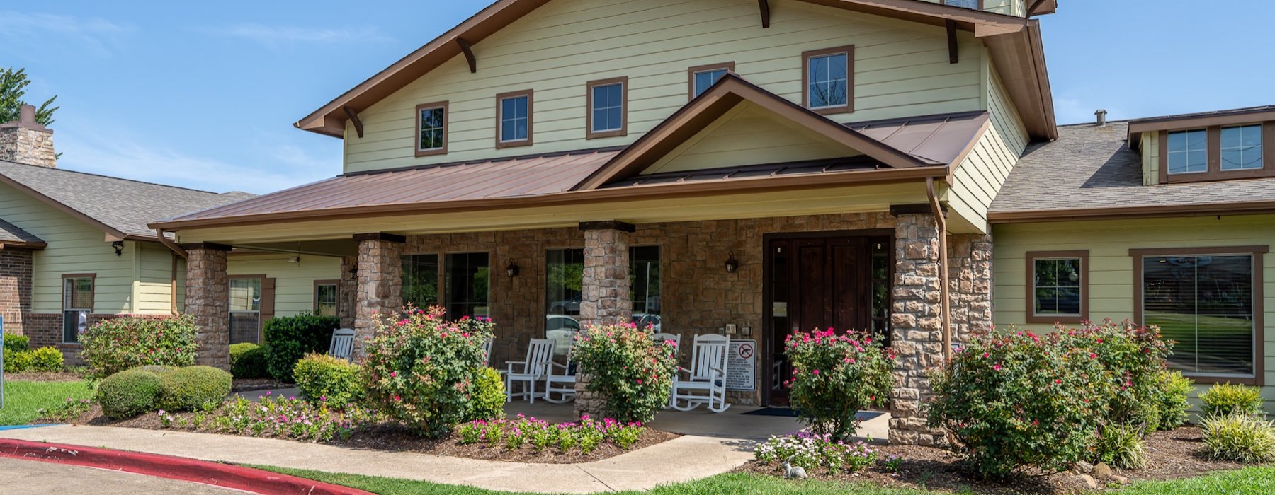 a building with a garden in front