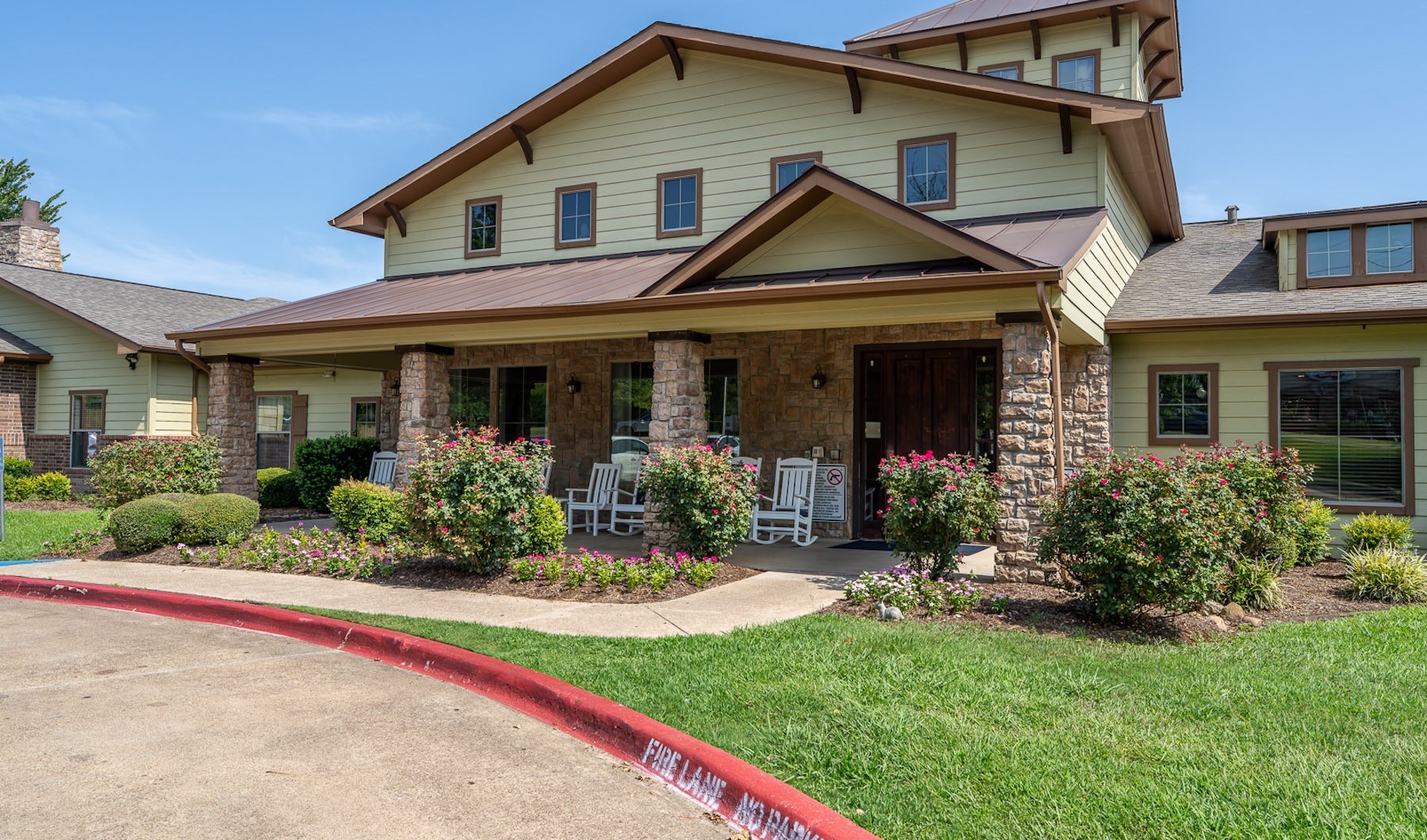 a building with a garden in front