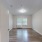 a room with white walls and a wood floor