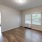 a room with a window and a wood floor
