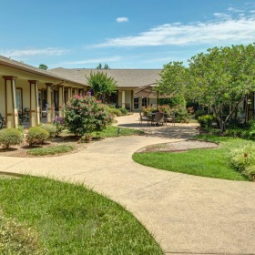 Settle into comfort at Hawkins Creek Assisted Living & Memory Care a walkway leading to houses